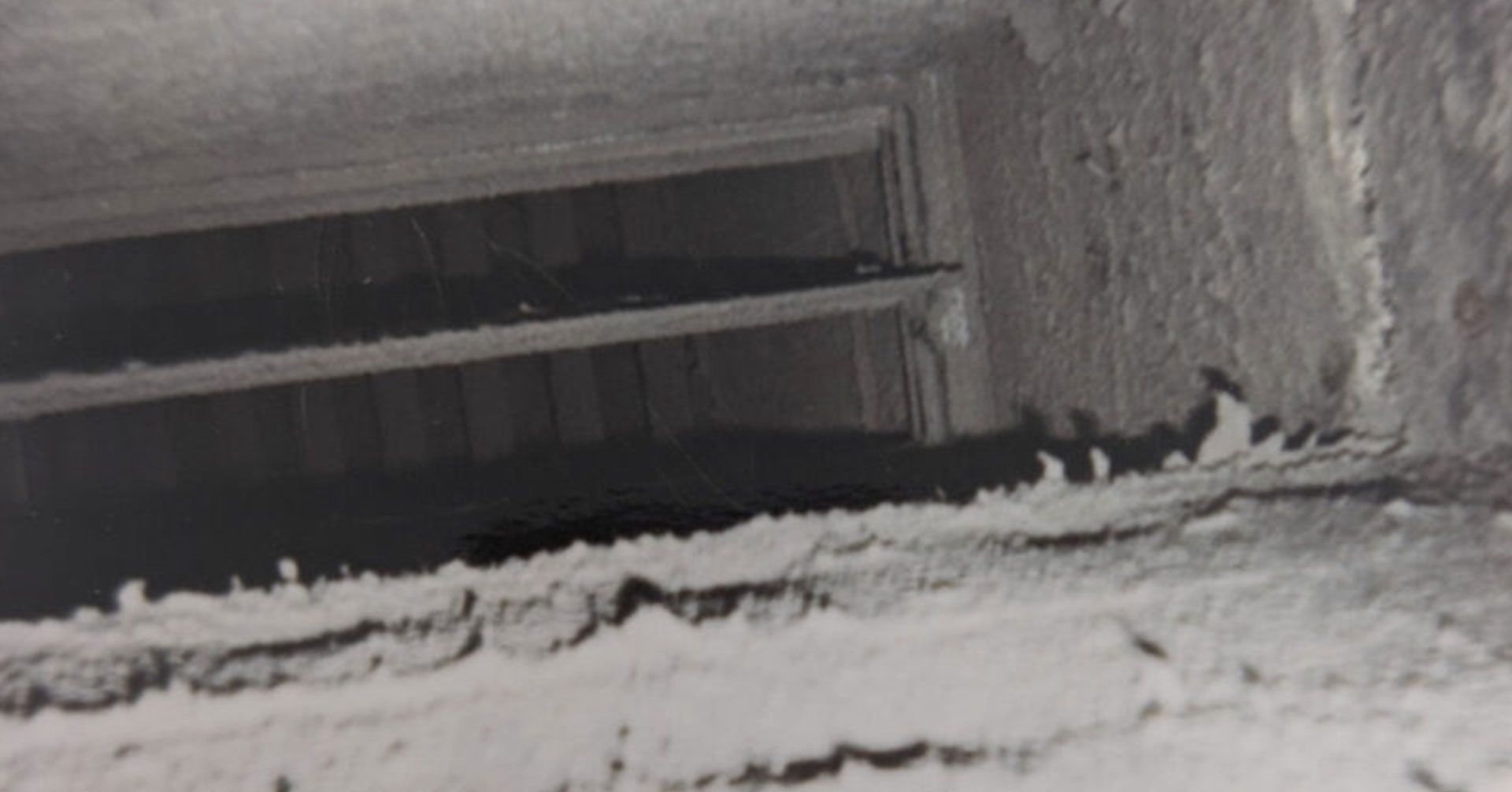 Interior of an air duct caked with dust before cleaning